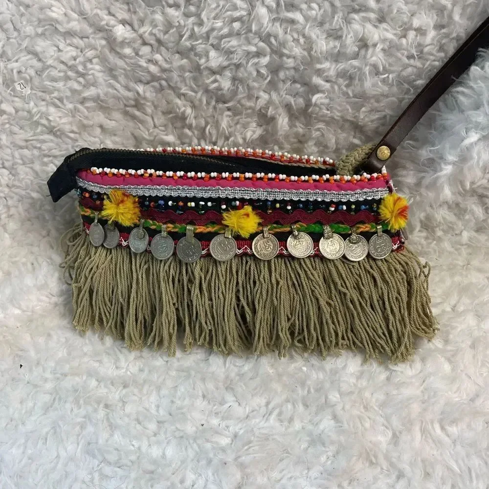 - Elliott Mann Indie multi color clutch with beads and coins accents.